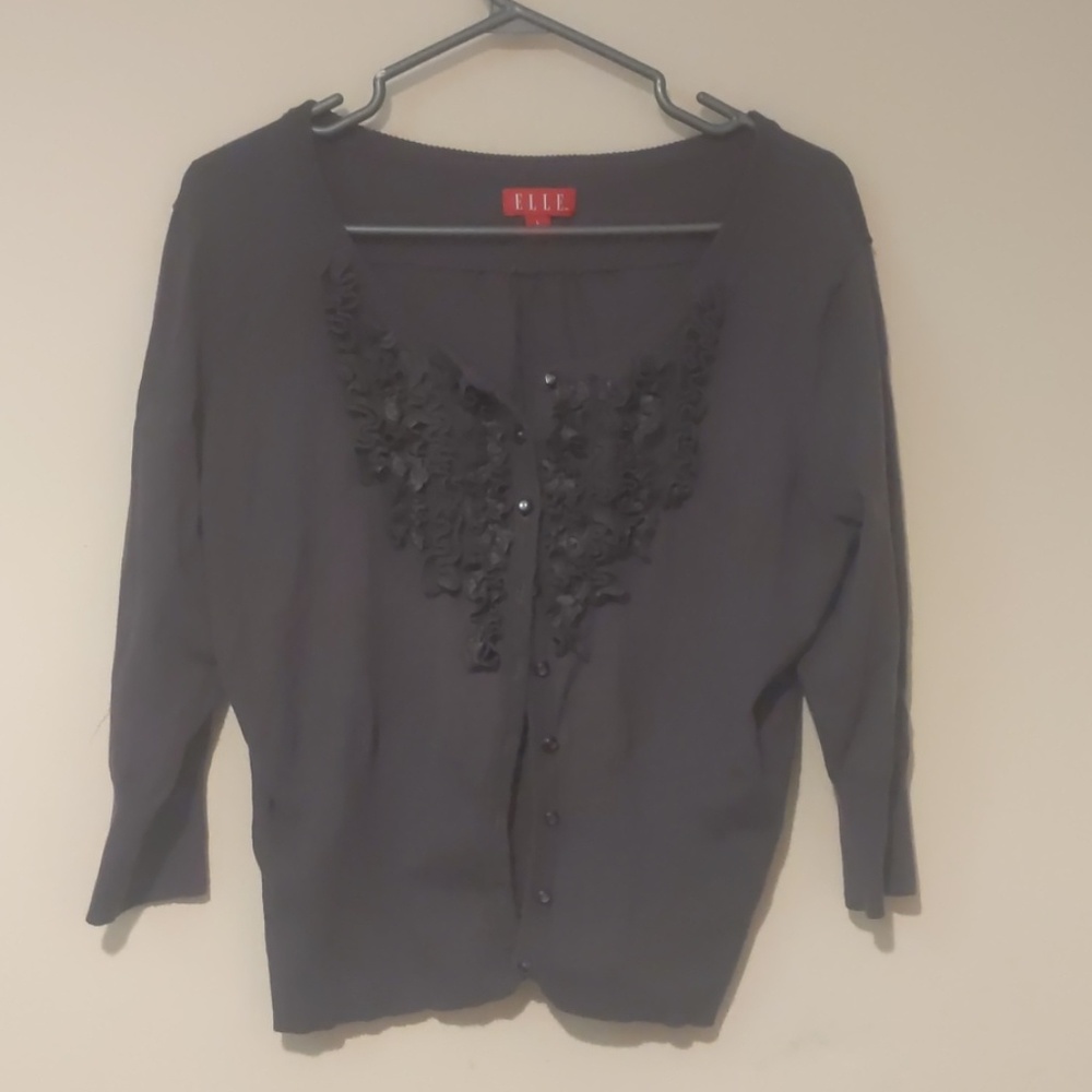 Grey ruffled cardigan.